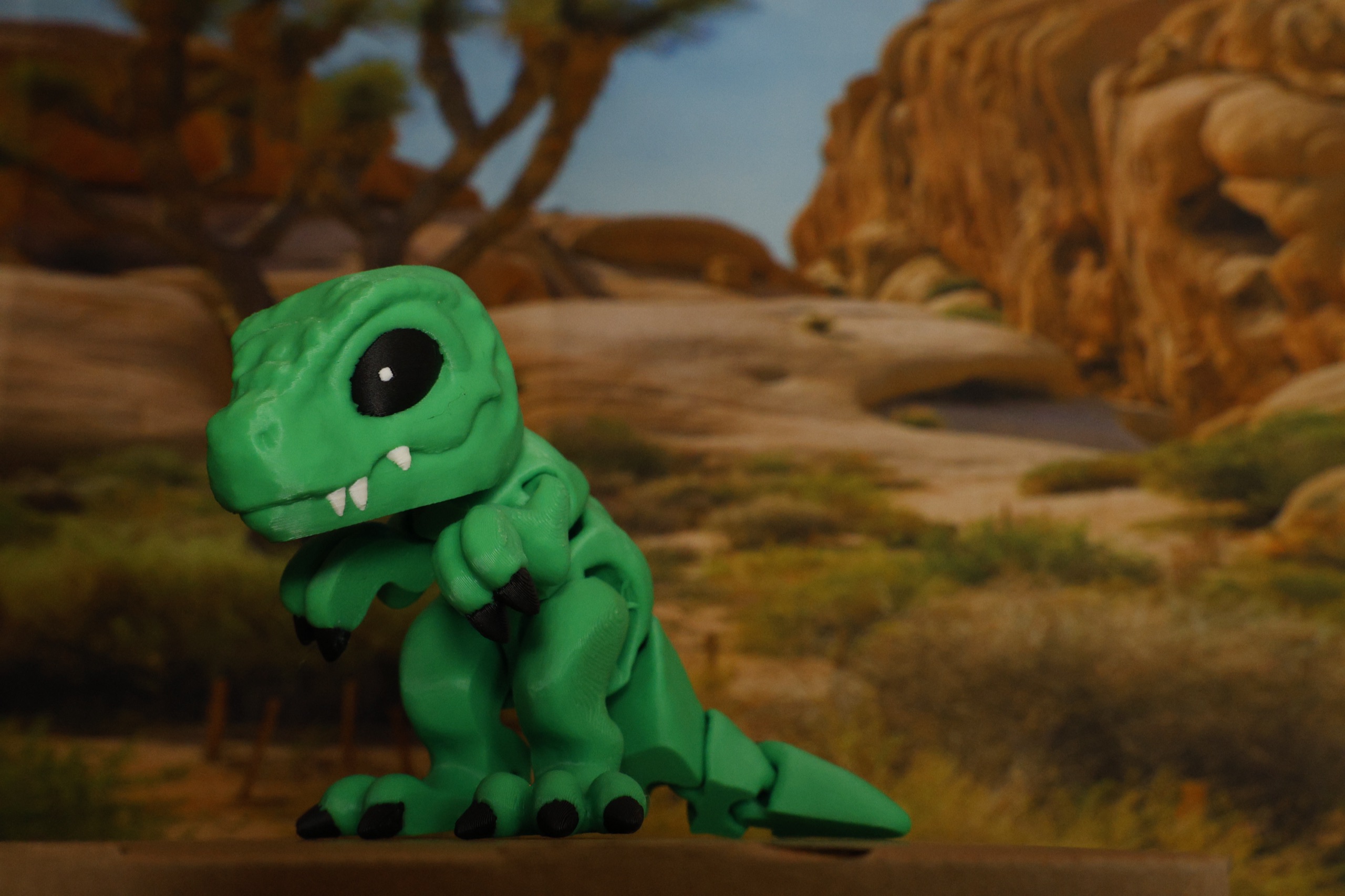 Green T-Rex in a desert diorama
