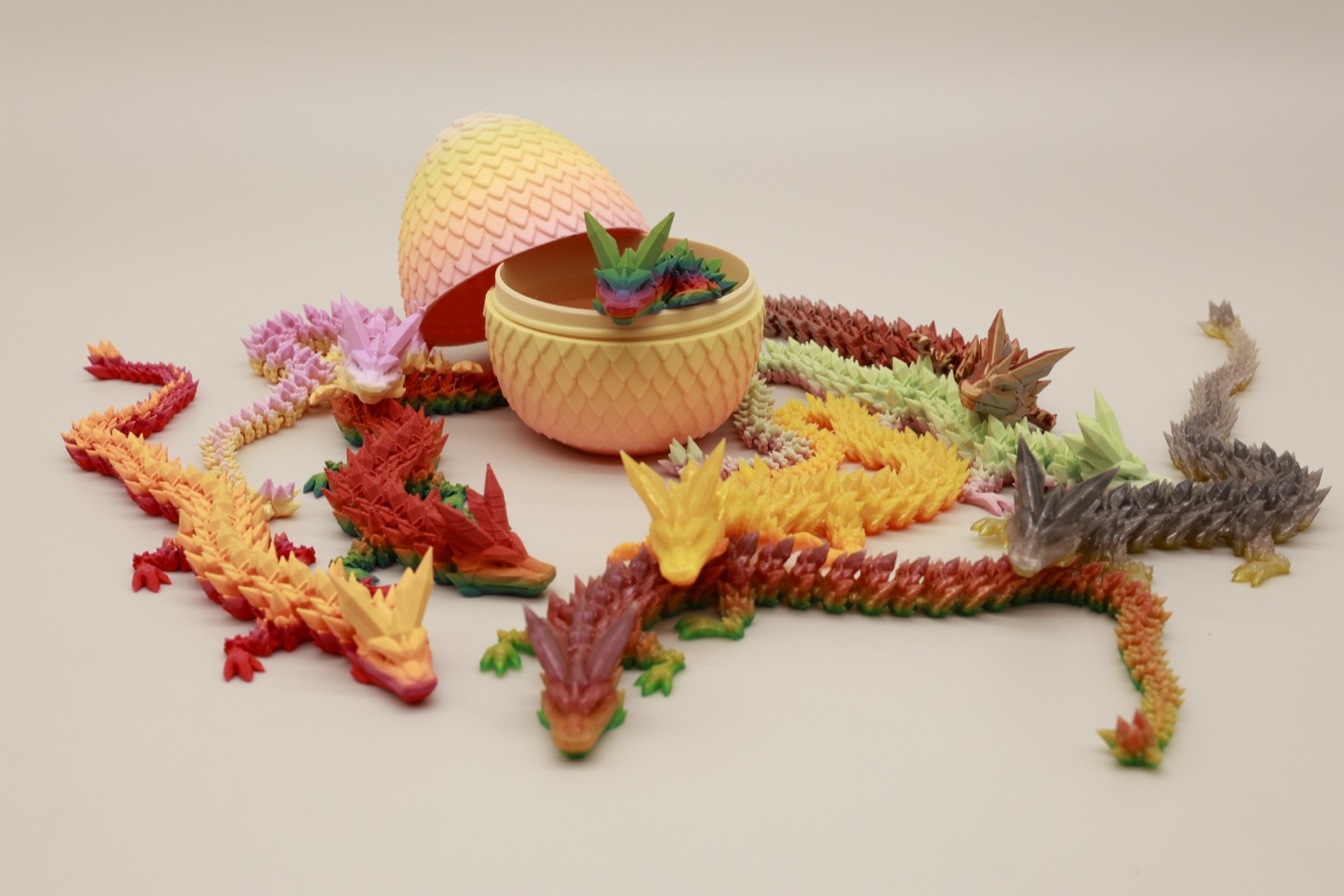 Small dragons gathered around an egg